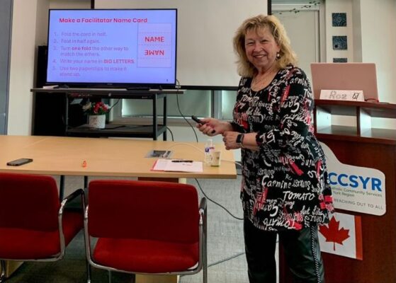 Focused adult student learning English online through a live video tutoring session