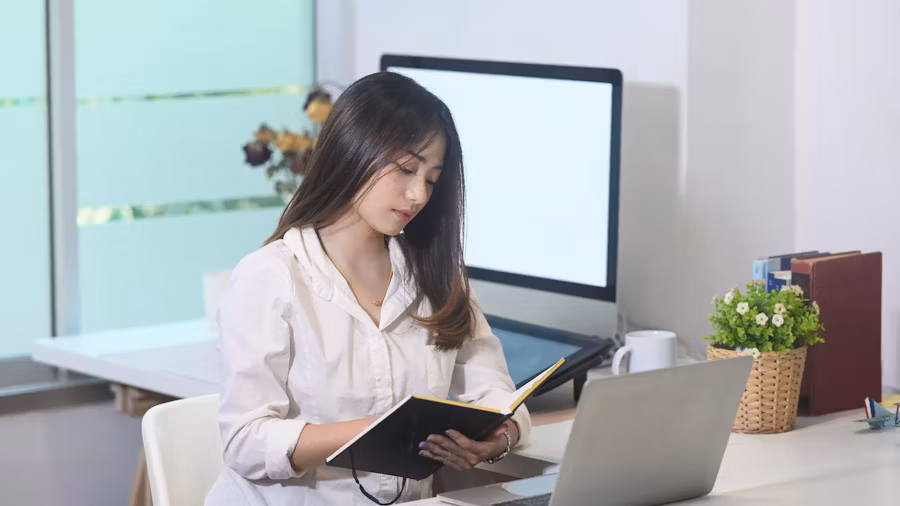 Business professional learning English for email and meetings